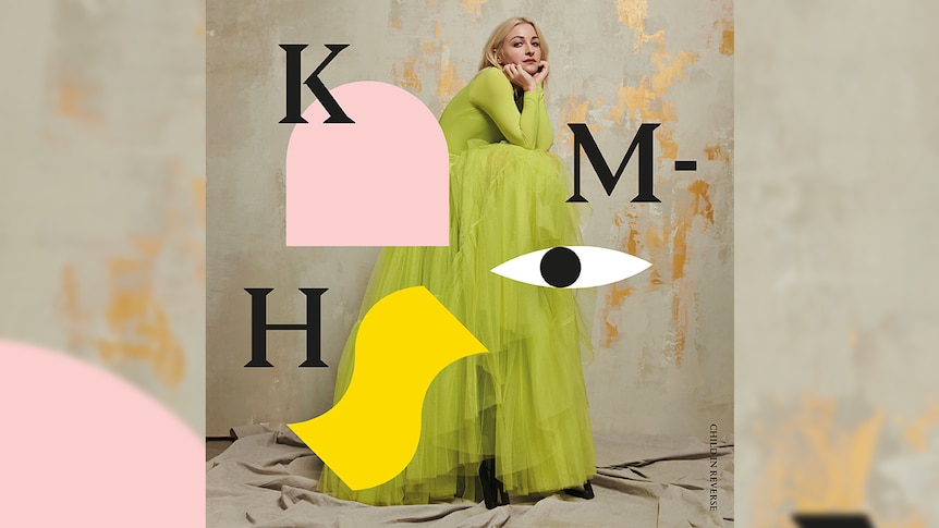 Kate Miller-Heidke in a green dress on the cover of her album Child In Reverse