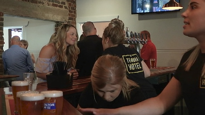 People being served at a bar