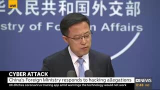 A Chinese Foreign Ministry spokesman speaks at a media conference