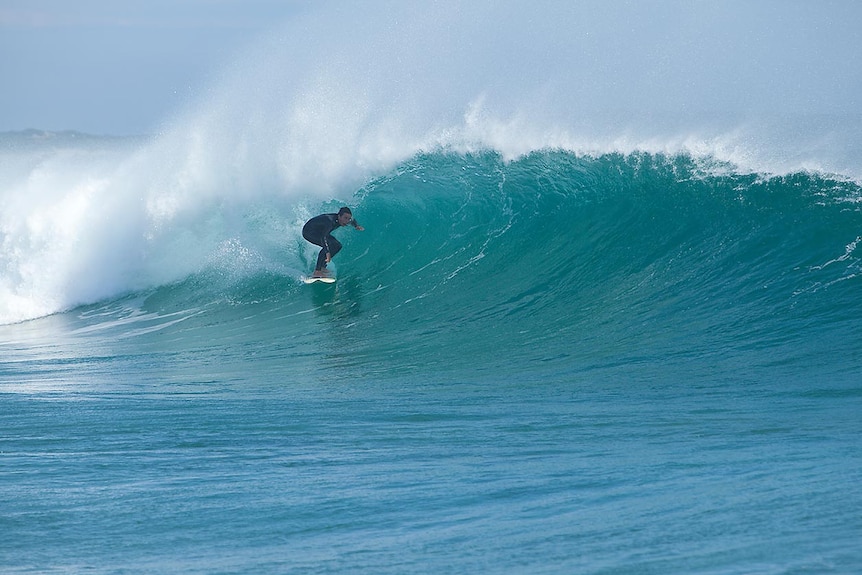 A surfer inside the barrel at Kelpies, Marrawah