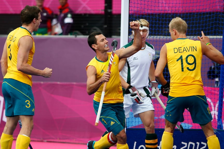 Australia's Jamie Dwyer (C) celebrates his goal against South Africa at the London Olympics.