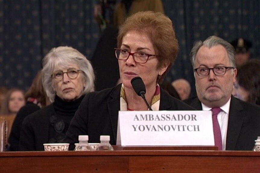 Marie Yovanovitch speaking into a microphone while seated