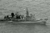 A black and white photo of a Chinese navy ship.