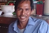Fisherman Sahring at home with his family in West Timor.