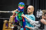 Laser Beak Man as a 3D wooden puppet as part of the stage performance.