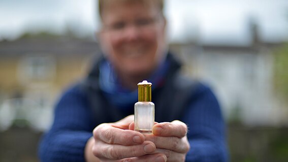A photo of a man holding a bottle from the Museum of Water collection