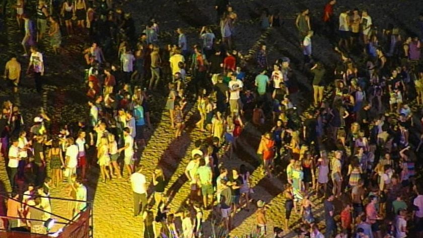 Schoolies gather at Surfers Paradise Beach on the Gold Coast.