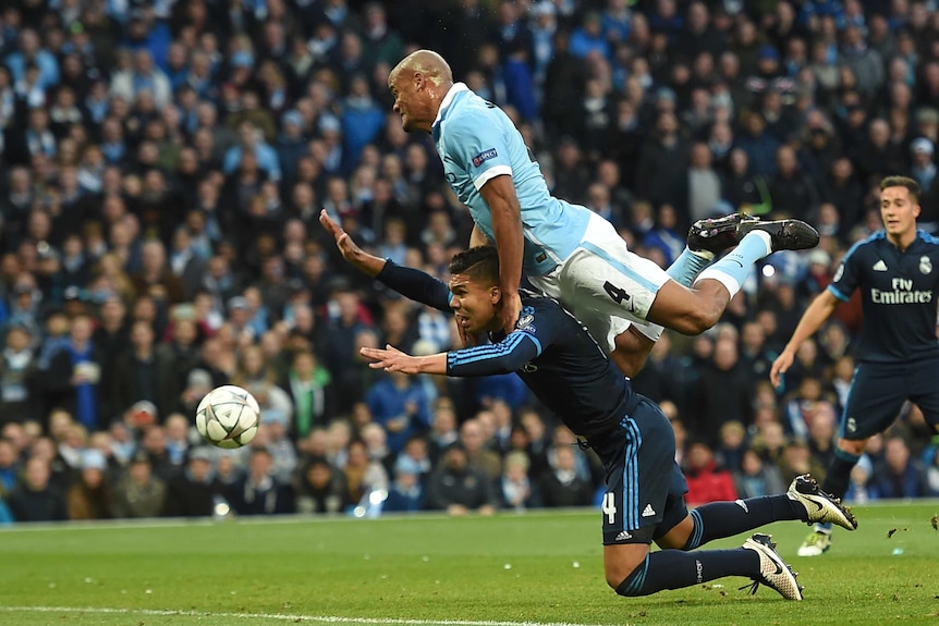 Vincent Kompany challenges Casemiro during Manchester City-Real Madrid Champions League semi-fina;