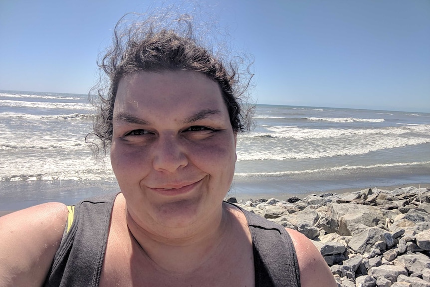 Claire Connors takes a selfie of herself on a beach