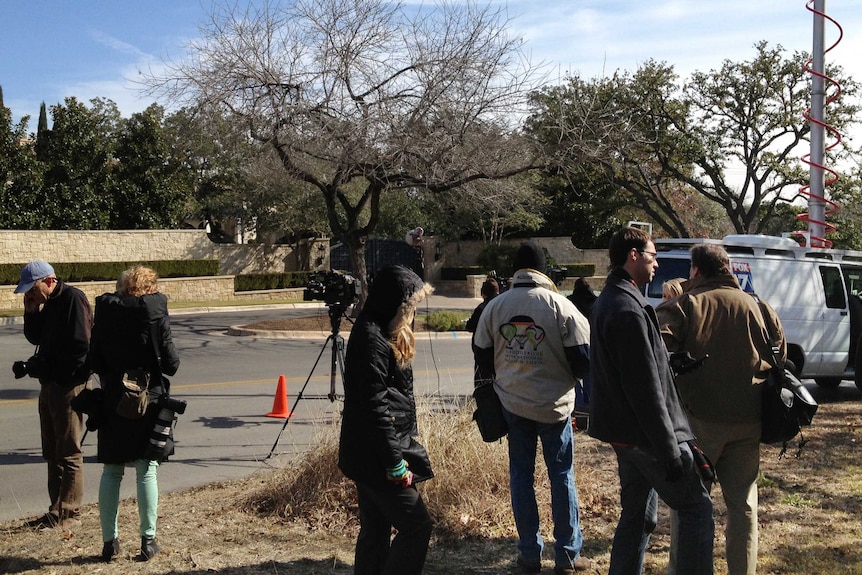 Reporters gather in front of Lance Armstrong's house in Austin, Texas.