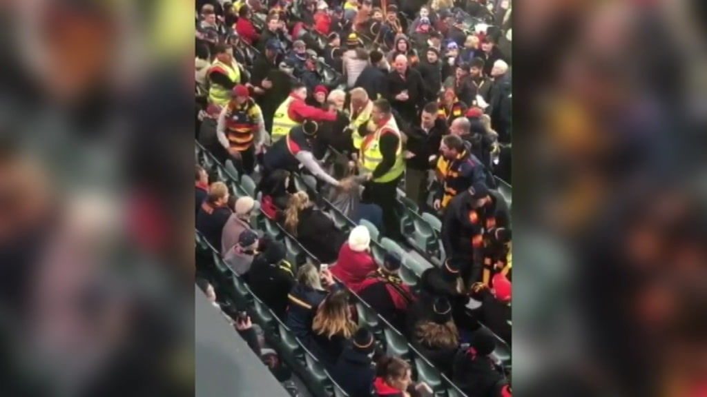 AFL spectators clash at Adelaide Oval, with woman and man charged with ...