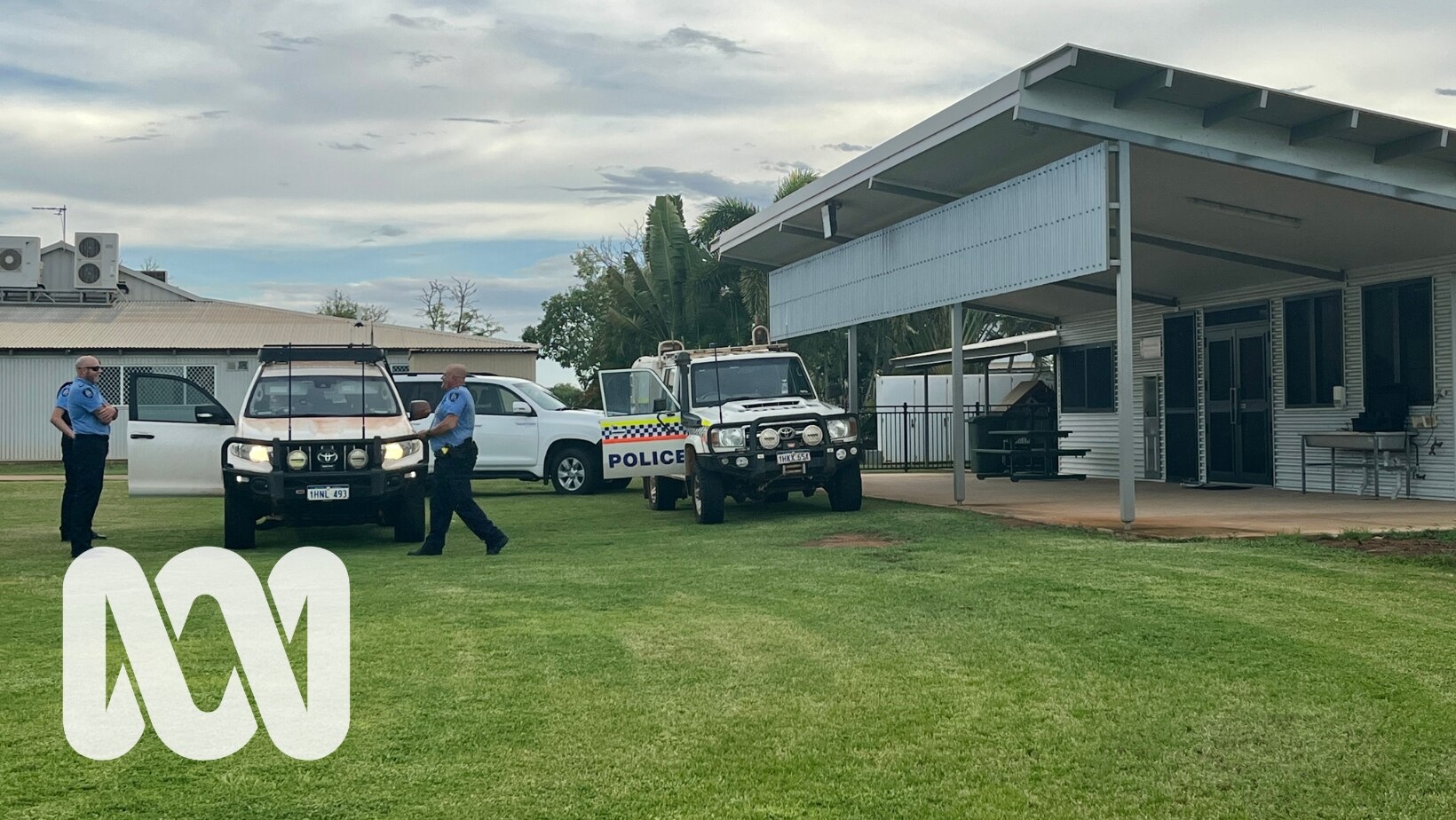 Police vehicles outside a school building.