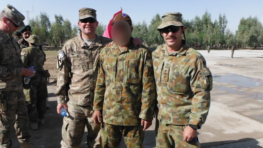 Afghan interpreter 'Hassan' with coalition troops in Afghanistan