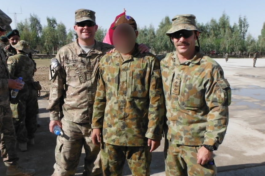 Afghan interpreter 'Hassan' with coalition troops in Afghanistan