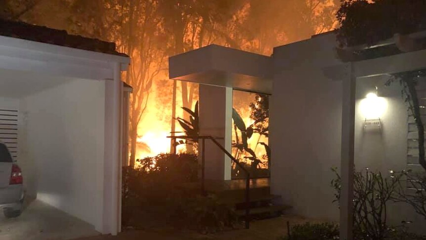 Fire near a home at Noosa Springs in August 2019.