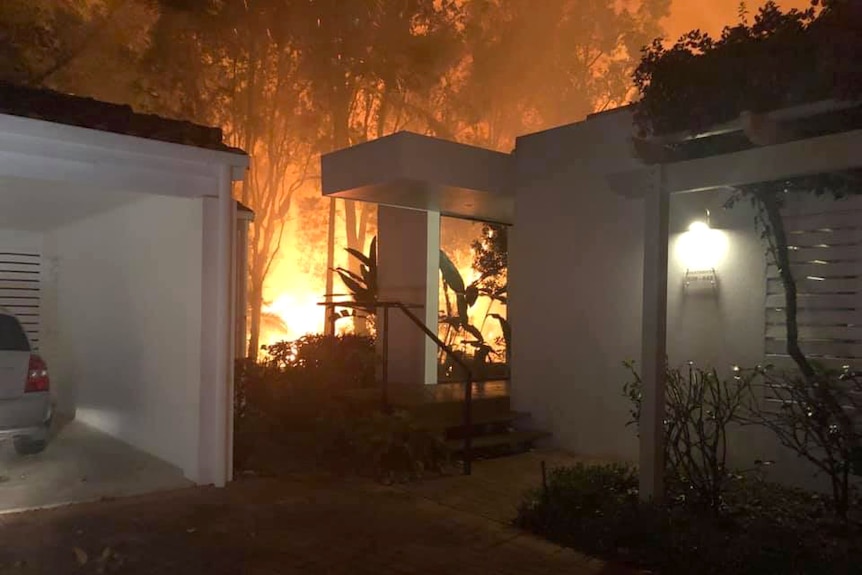 Fire near a home at Noosa Springs in August 2019.