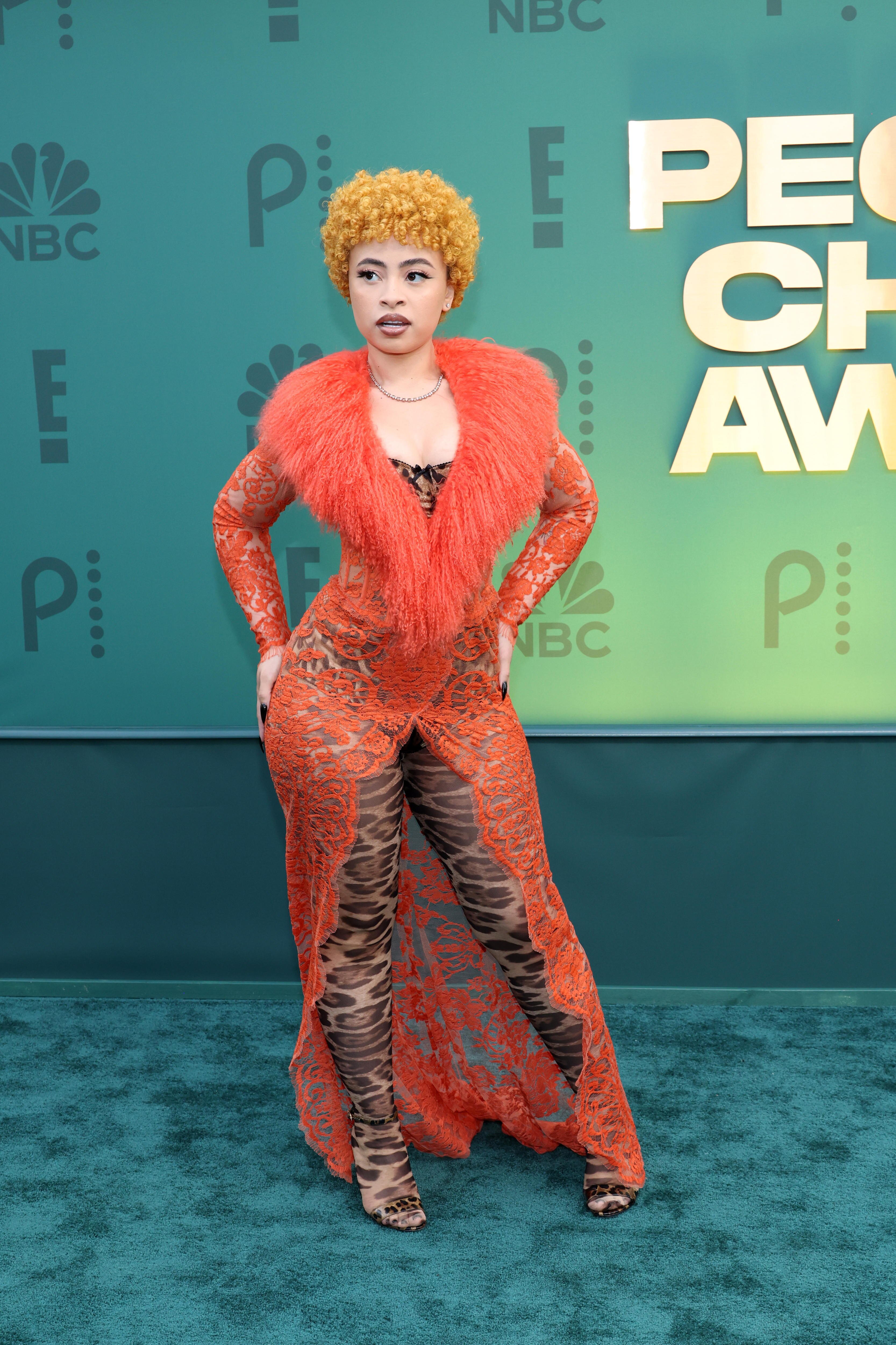 Ice Spice on the red carpet with a leopard print bodice and an orange furry piece on top