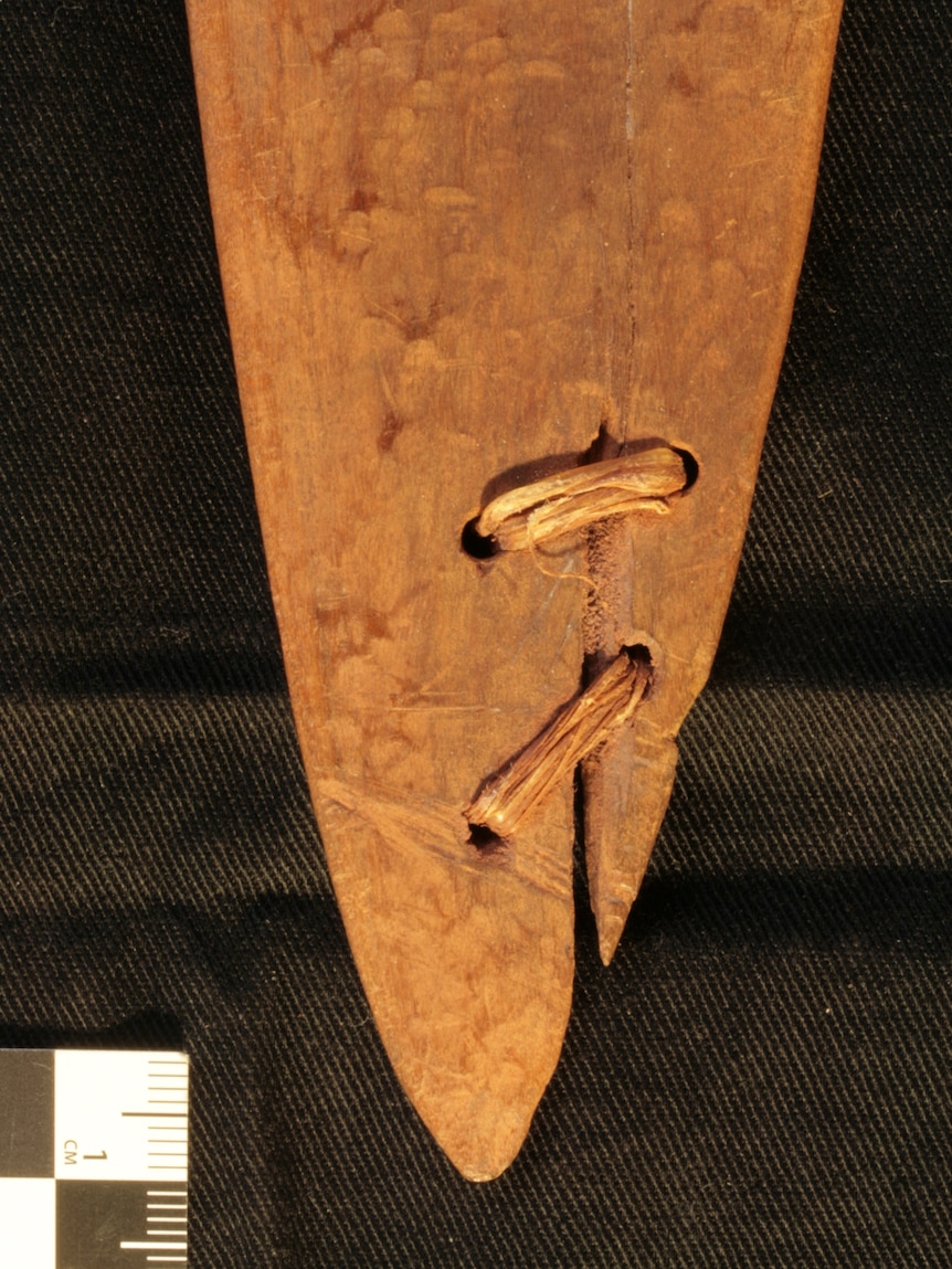 Close up of a repaired hardwood boomerang