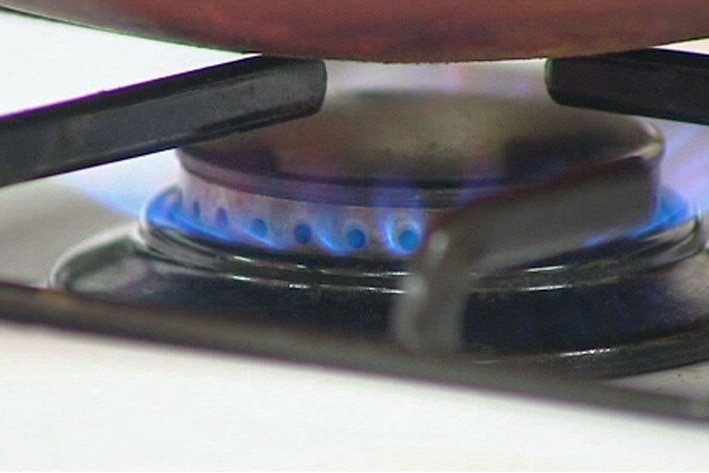 A stove top gas burner cooking