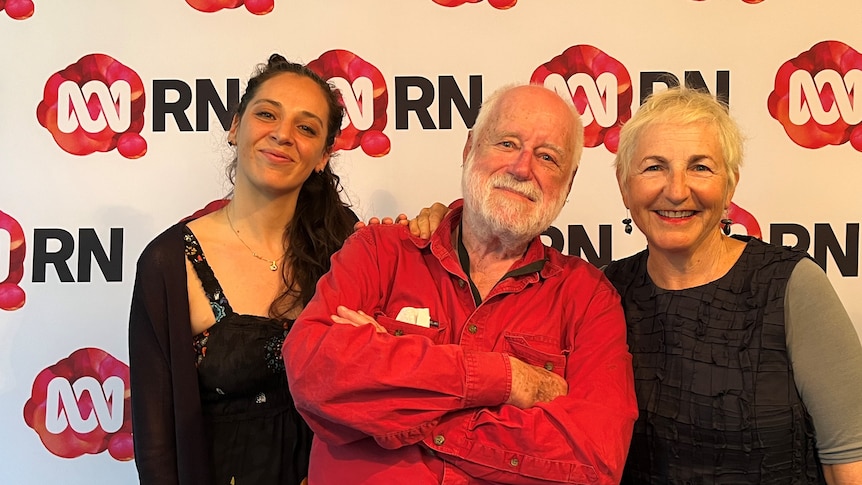 Sharon Ryba-Kahn, Phillip Adams and Ella Dreyfus in front of a Radio National banner