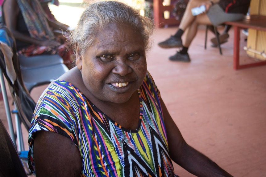 A portrait of a woman with a colourful dress.