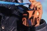 An unidentified hand holds a Vancouver Paralympics bronze medal