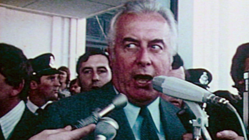 Prime Minister Gough Whitlam addresses reporters outside the Parliament building in Canberra, 1975