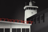 An almost grey scale illustration of the exterior of Don Dale. Barbed wire is highlighted in red. 