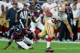 Jarryd Hayne #38 for the San Francisco 49ers breaks a tackle against Houston on August 15, 2015.