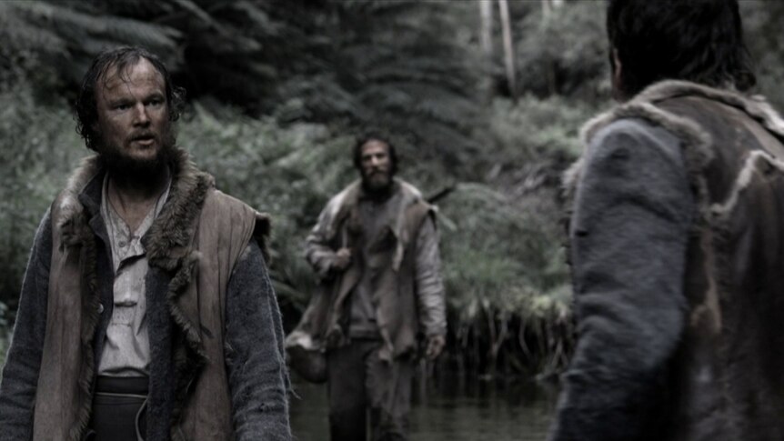 Convicts in Tasmanian bush as depicted in a movie.