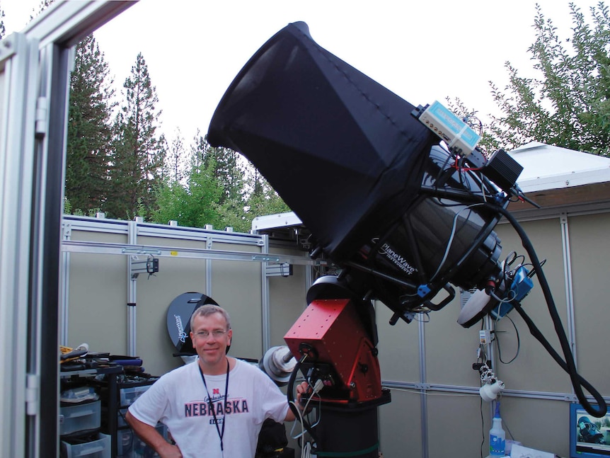 Martin with a giant black telescope