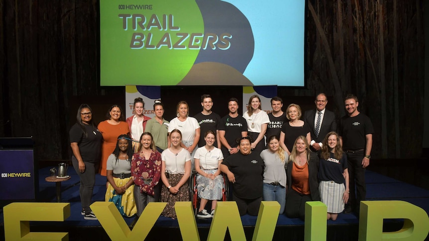 The group of 18 ABC Heywire Trailblazers with Ita Buttrose and David Anderson