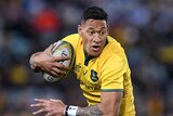 A rugby player wearing black tackles Israel Folau while another player in black watches on