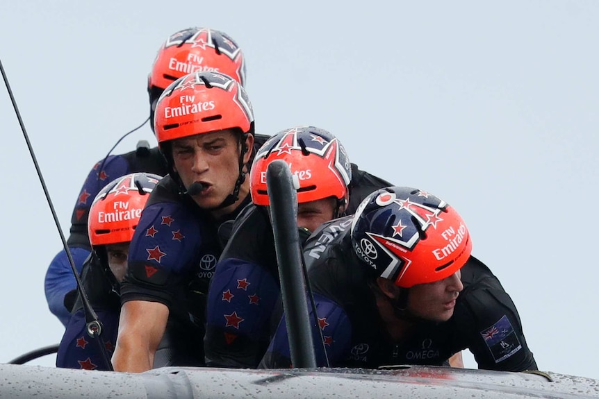 Team New Zealand cyclors cross the finish line to win the fifth race of America's Cup on Saturday.