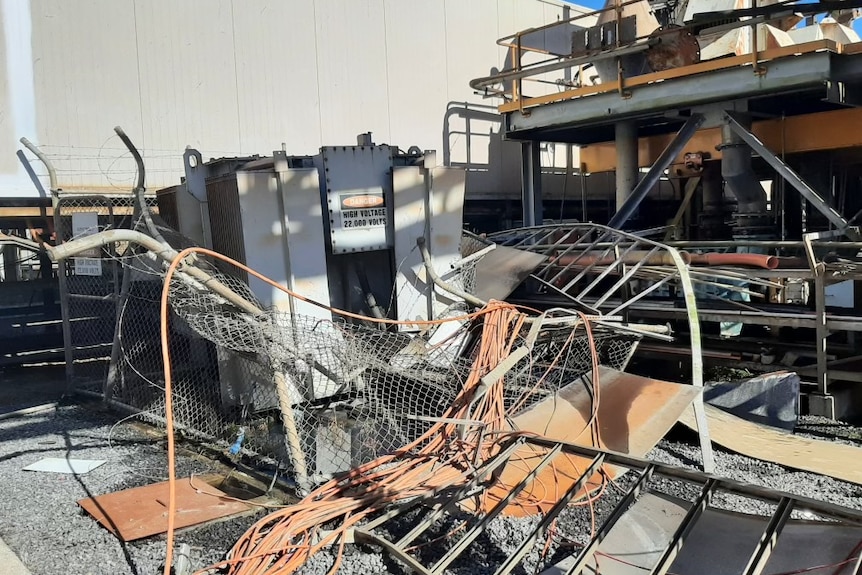 Mangled wiring and power infrastructure after a theft attempt at an industrial site.