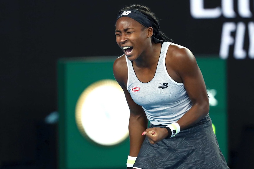 An American female tennis player screams out as she celebrates winning a point at the Australian Open.