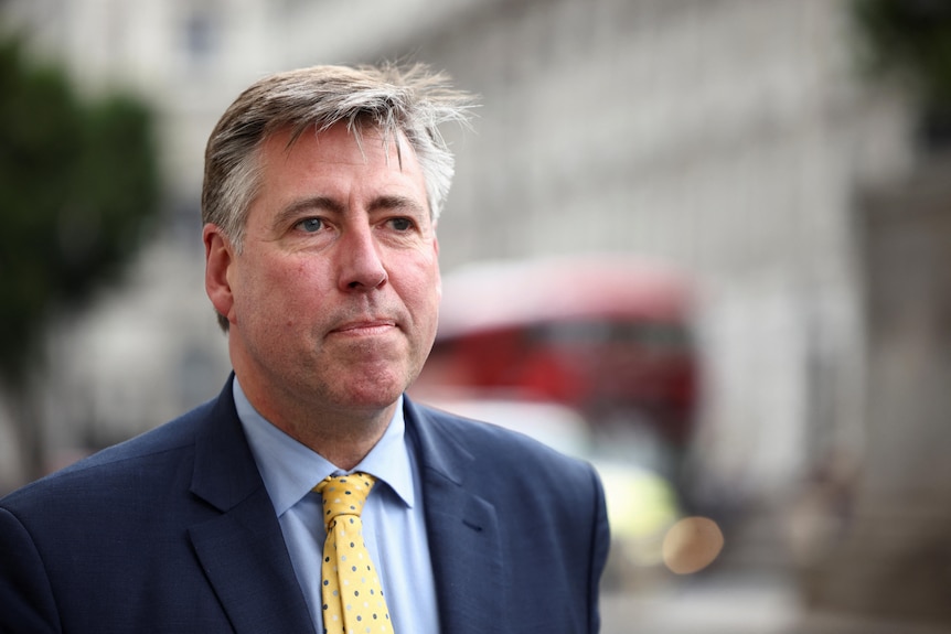 A portrait photo of Chairman of the 1922 Committee Graham Brady on a road. 