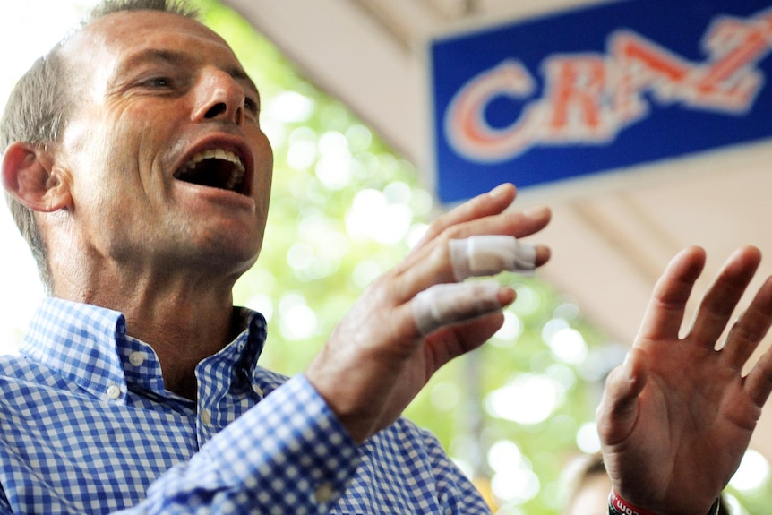 Federal Opposition Leader Tony Abbott with buskers at the Tamworth Country Music Festival.