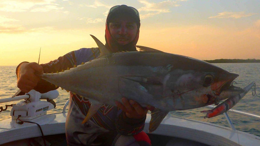Man holding big tuna