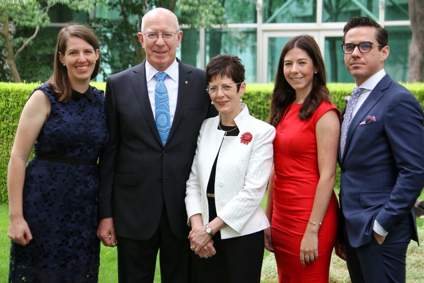 Governor Hurley and his family pose for a photo in one of the courtyards of Parliament House.