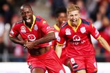 Bruce Djite celebrates a goal for Adelaide United