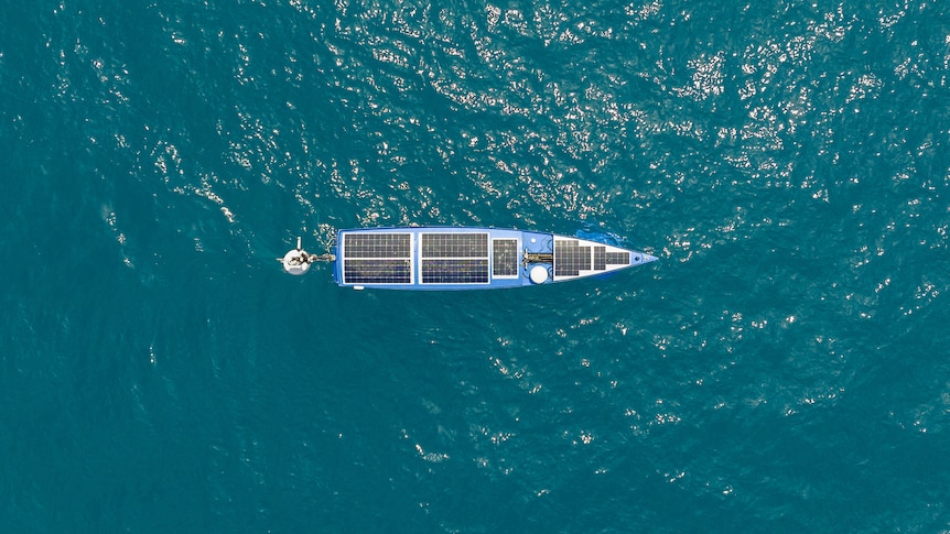 top view of a vessel which looks like a yacht in blue water