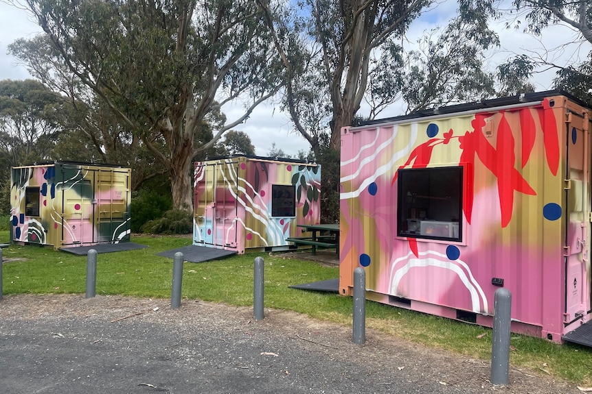 three shipping container cubes in park