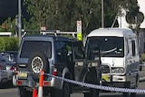 The gunmen rammed the van before shooting into its side windows.