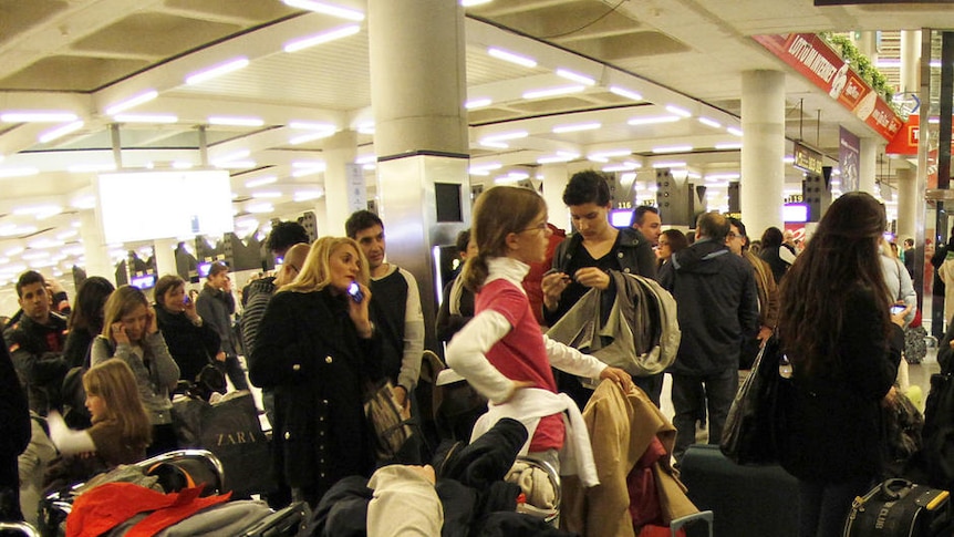 Commuters wait for flights