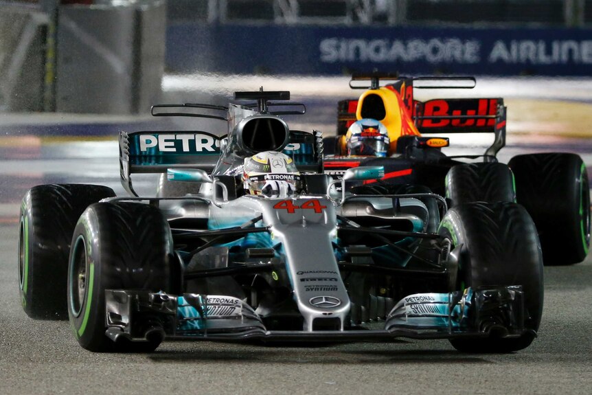 Mercedes driver Lewis Hamilton is seen leading Red Bull's Daniel Ricciardo