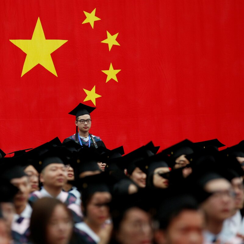 Students attend a graduation ceremony at Fudan University in Shanghai, China.