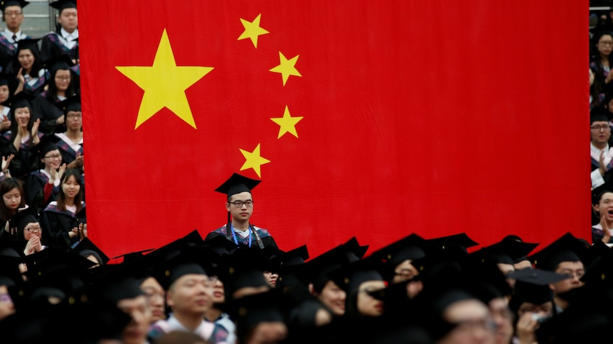 Students attend a graduation ceremony at Fudan University in Shanghai, China.