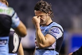 Nicho Hynes looks upset after the Sharks' NRL loss to the Dolphins.