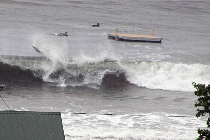 Surfer crashes off a wave in Tasmania